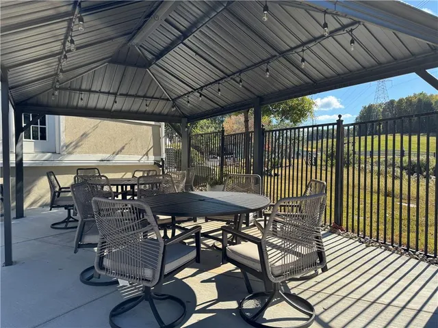 a bathroom with a sink mirror and toilet