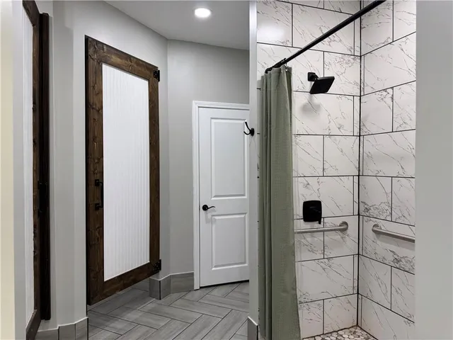 a swimming pool with an outdoor space and seating