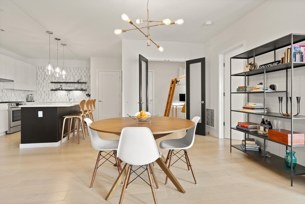 45 West 3rd Street, Unit 512 Boston, MA 02127 - Photo 14 of 40 a dining room with furniture and a table