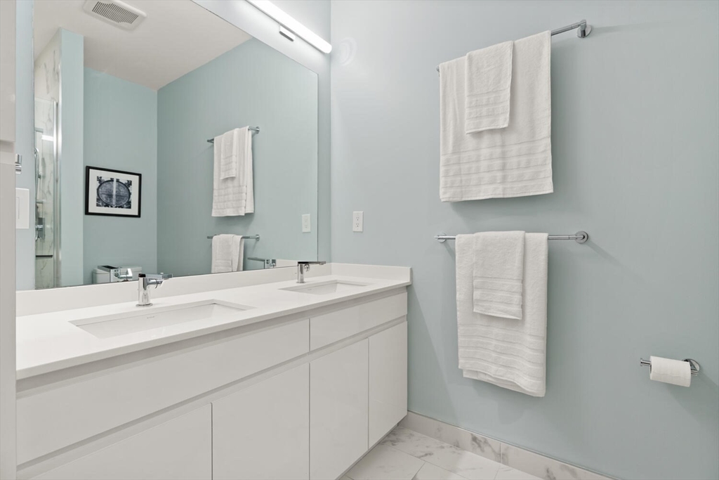 45 West 3rd Street, Unit 512 Boston, MA 02127 - Photo 23 of 40 a bathroom with a sink and a mirror