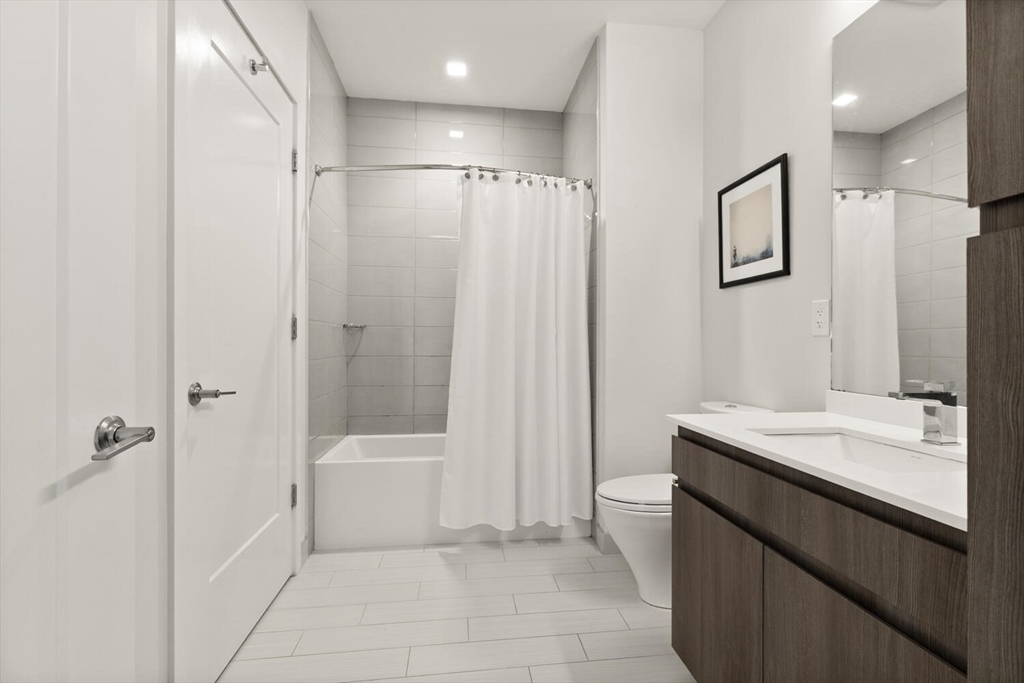 45 West 3rd Street, Unit 512 Boston, MA 02127 - Photo 26 of 40 a bathroom with a sink a toilet and shower