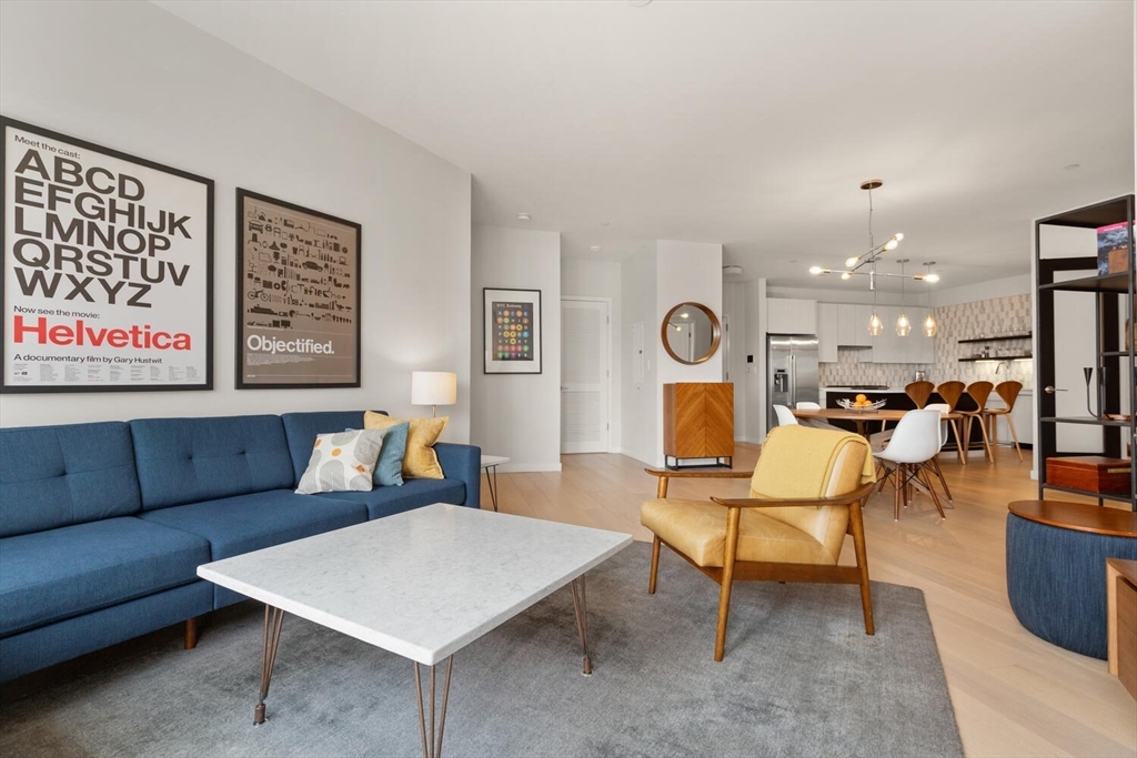 45 West 3rd Street, Unit 512 Boston, MA 02127 - Photo 3 of 40 a living room with furniture and a table