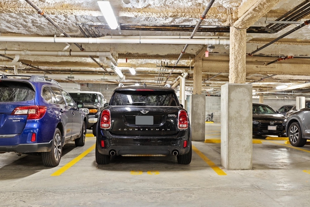 45 West 3rd Street, Unit 512 Boston, MA 02127 - Photo 31 of 40 a view of parking garage with cars parked