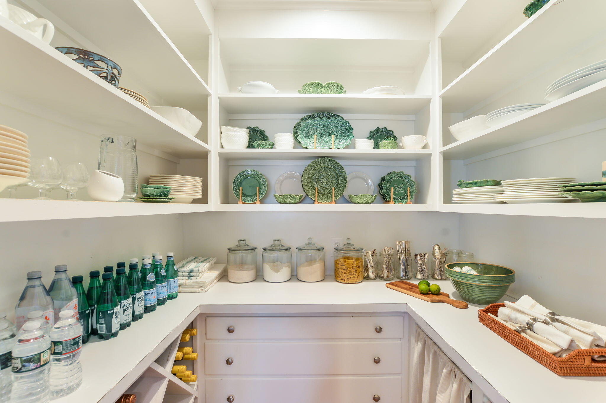 20 Stanley Place Hyannis, MA 02601 - Photo 17 of 37 a white kitchen with lots of bottles of alcohol