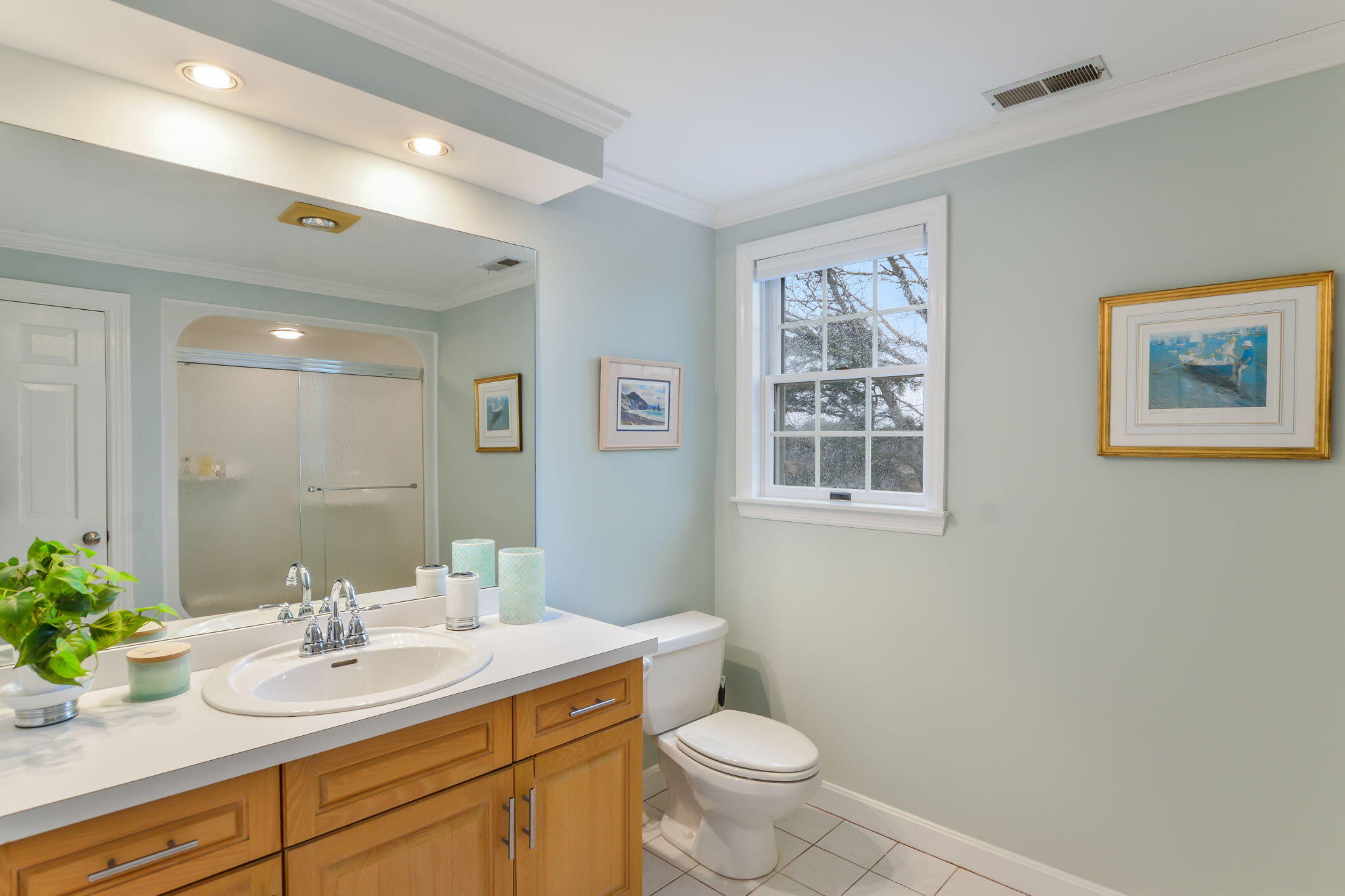 20 Stanley Place Hyannis, MA 02601 - Photo 29 of 37 a bathroom with a toilet sink and mirror