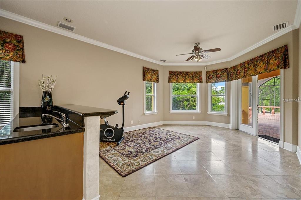 13161 Lake Butler Boulevard Windermere, FL 34786 - Photo 15 of 30 a view of a livingroom with furniture and windows
