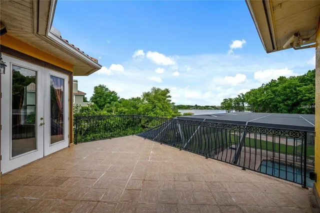a balcony with trees in front of it