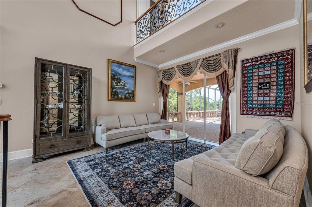 13161 Lake Butler Boulevard Windermere, FL 34786 - Photo 19 of 30 a living room with furniture and a large window