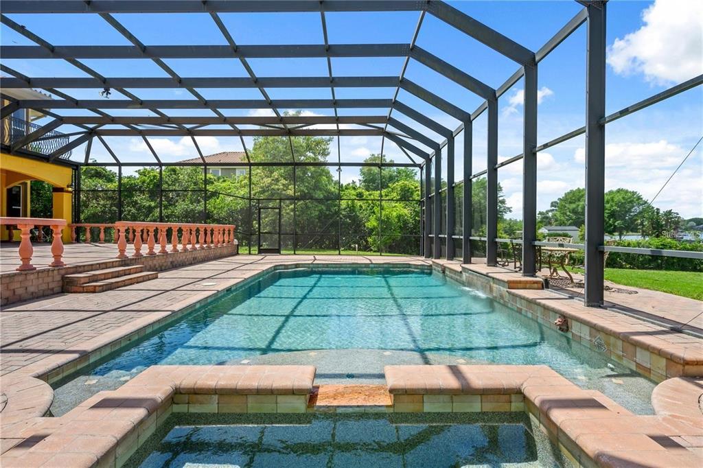 13161 Lake Butler Boulevard Windermere, FL 34786 - Photo 22 of 30 a view of a backyard with a small deck and a garden