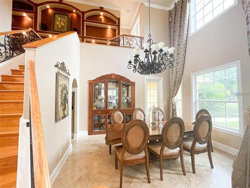 13161 Lake Butler Boulevard Windermere, FL 34786 - Photo 8 of 30 a view of a dining room with furniture window and outside view