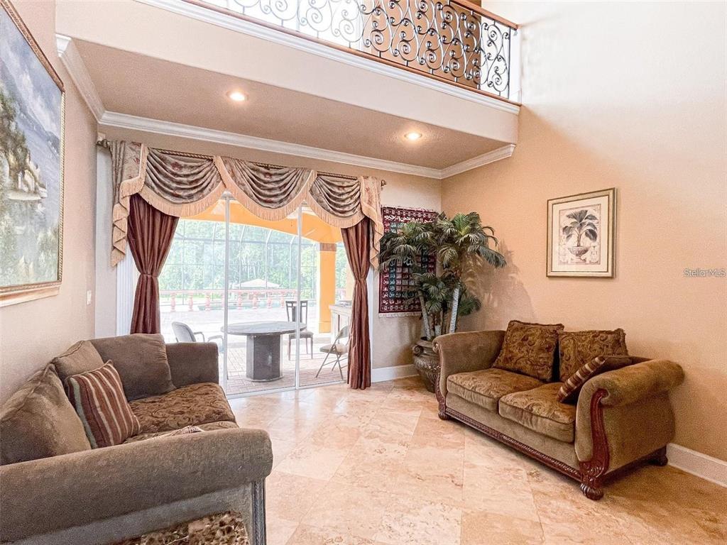13161 Lake Butler Boulevard Windermere, FL 34786 - Photo 9 of 30 a living room with furniture and a large window