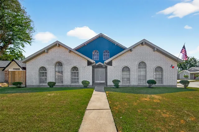 a front view of house with yard and green space