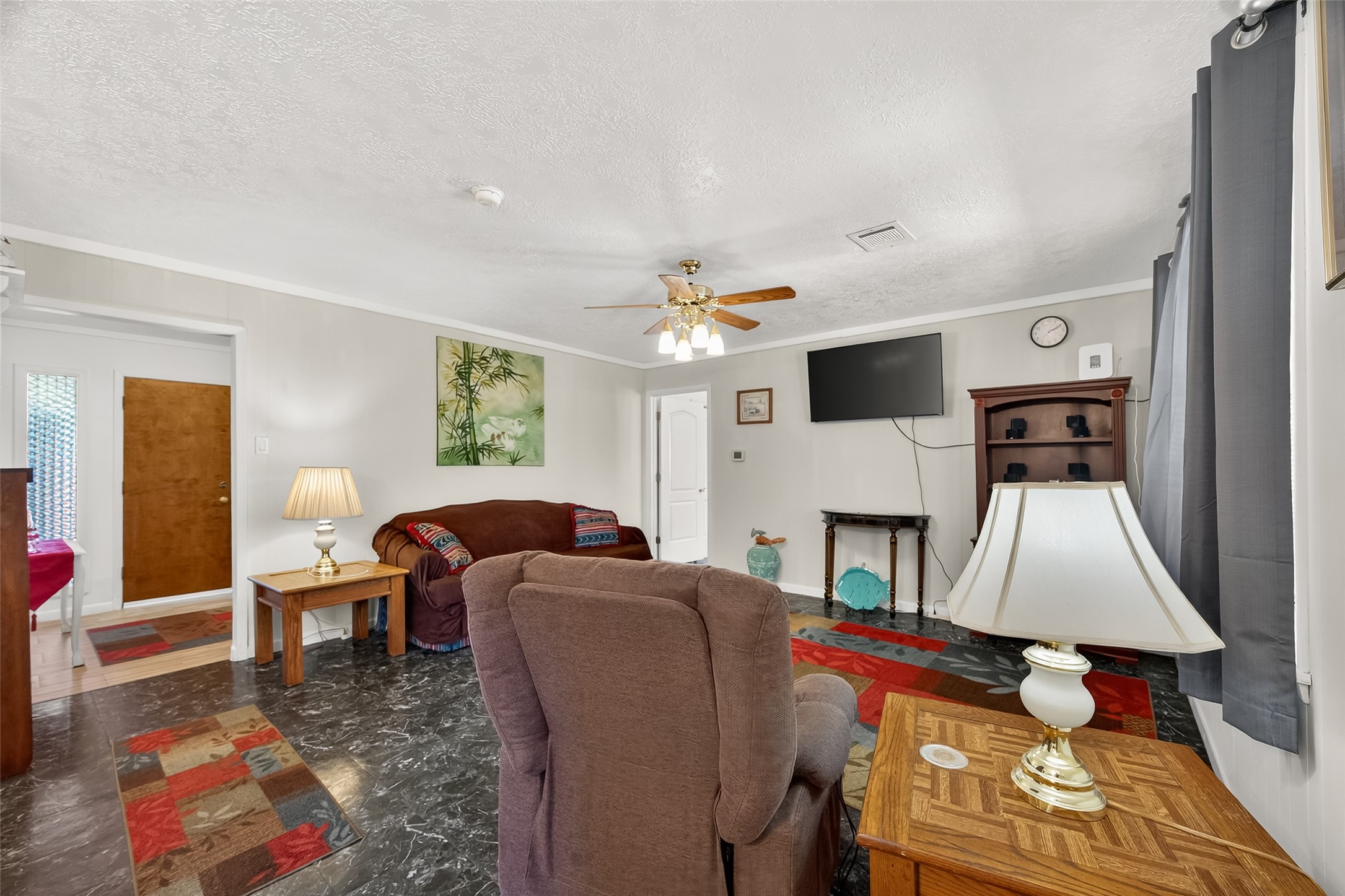 4802 Mistletoe Road Pasadena, TX 77505 - Photo 12 of 41 a living room with furniture fireplace and flat screen tv