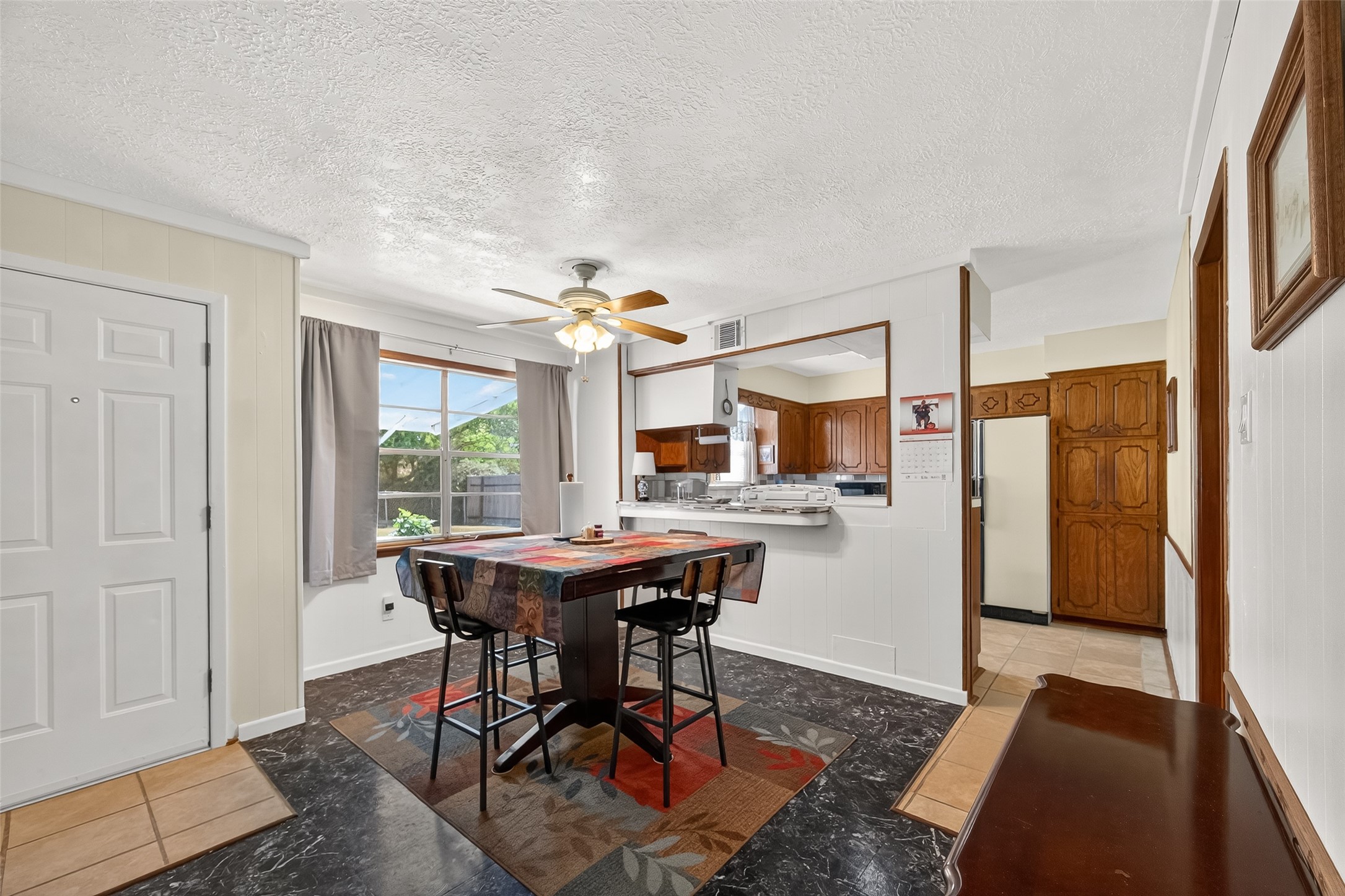 4802 Mistletoe Road Pasadena, TX 77505 - Photo 15 of 41 a view of a dining room with furniture window and wooden floor
