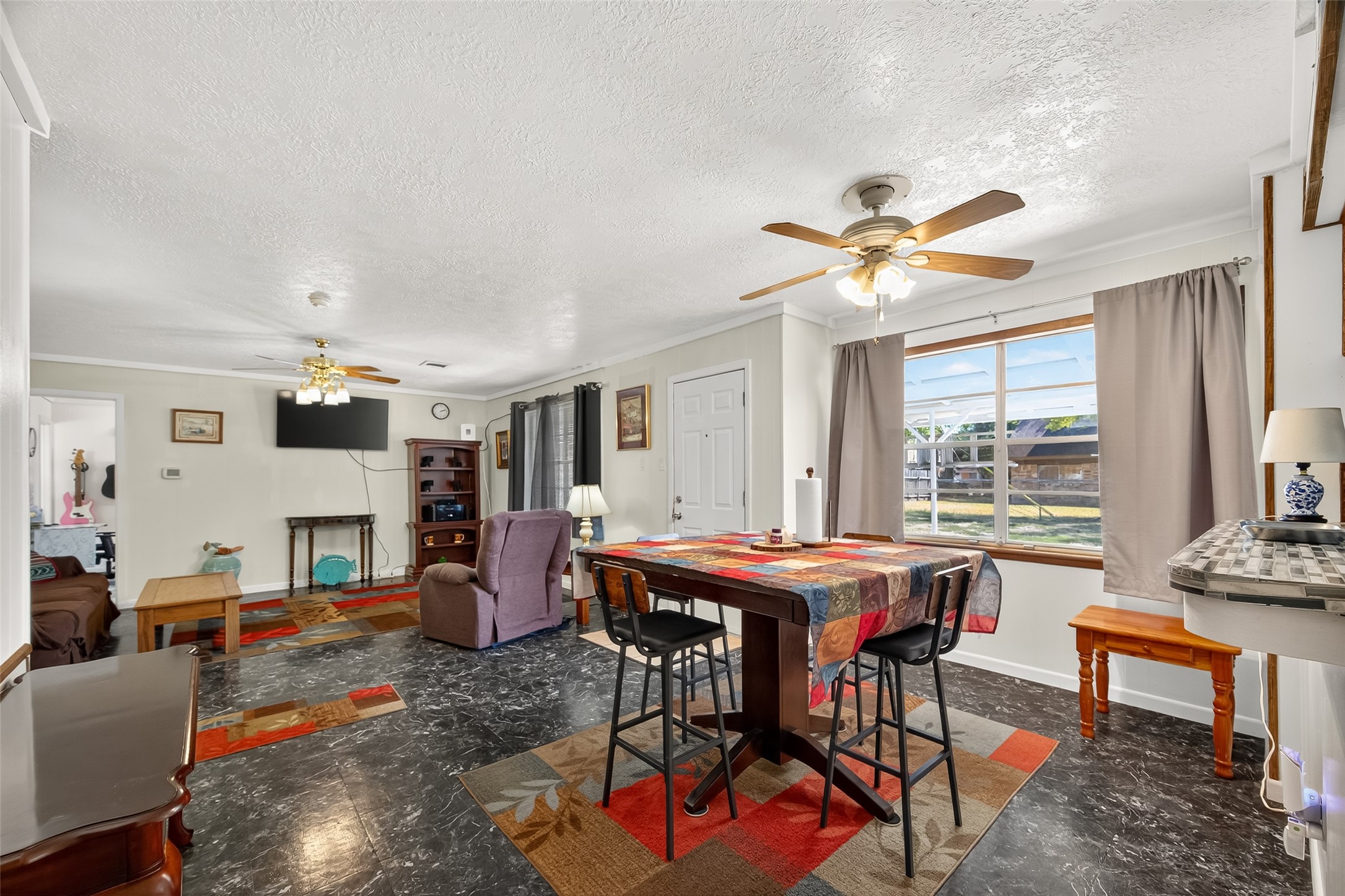 4802 Mistletoe Road Pasadena, TX 77505 - Photo 16 of 41 a view of a dining room with furniture window and wooden floor