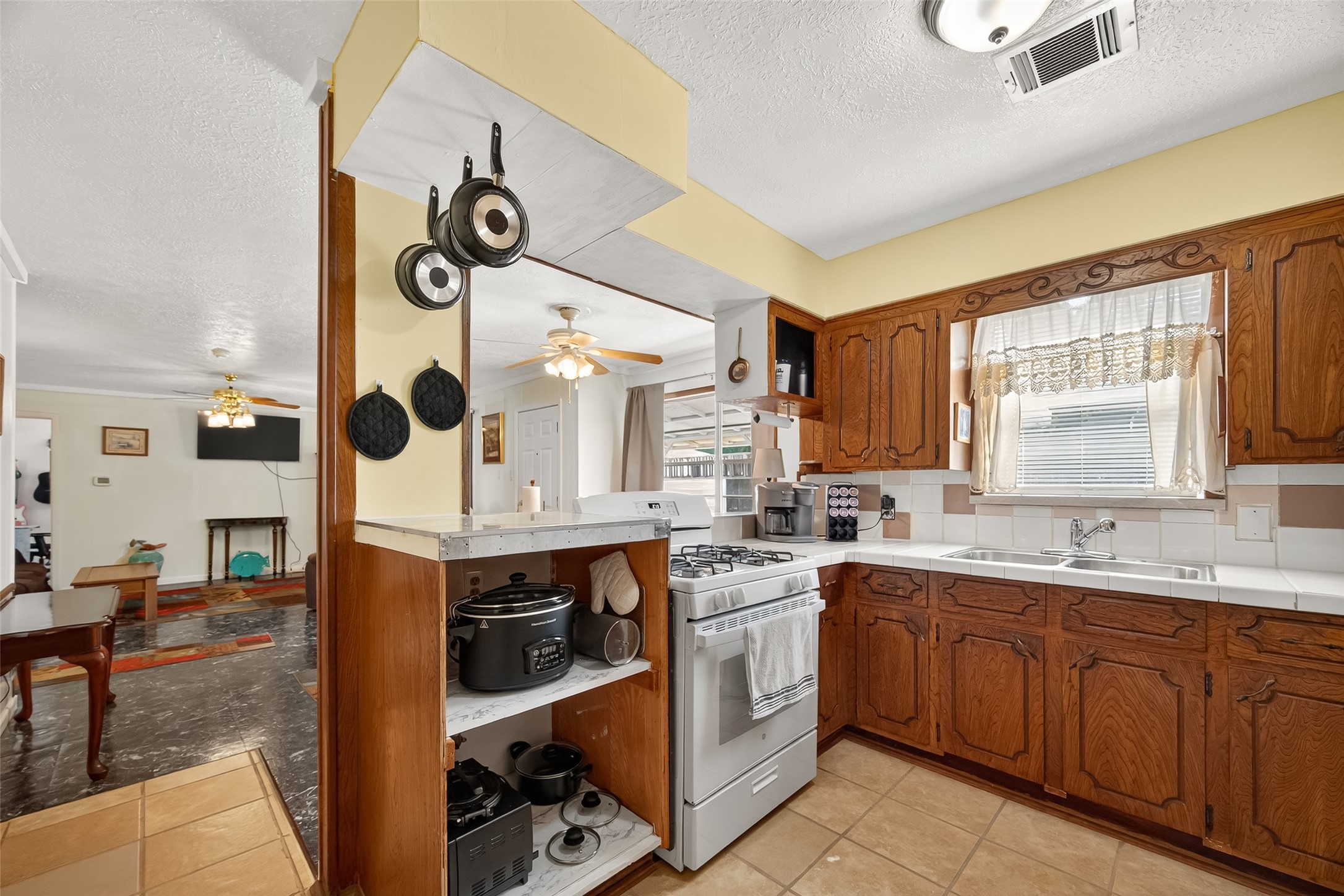 4802 Mistletoe Road Pasadena, TX 77505 - Photo 19 of 41 a kitchen with a sink and cabinets