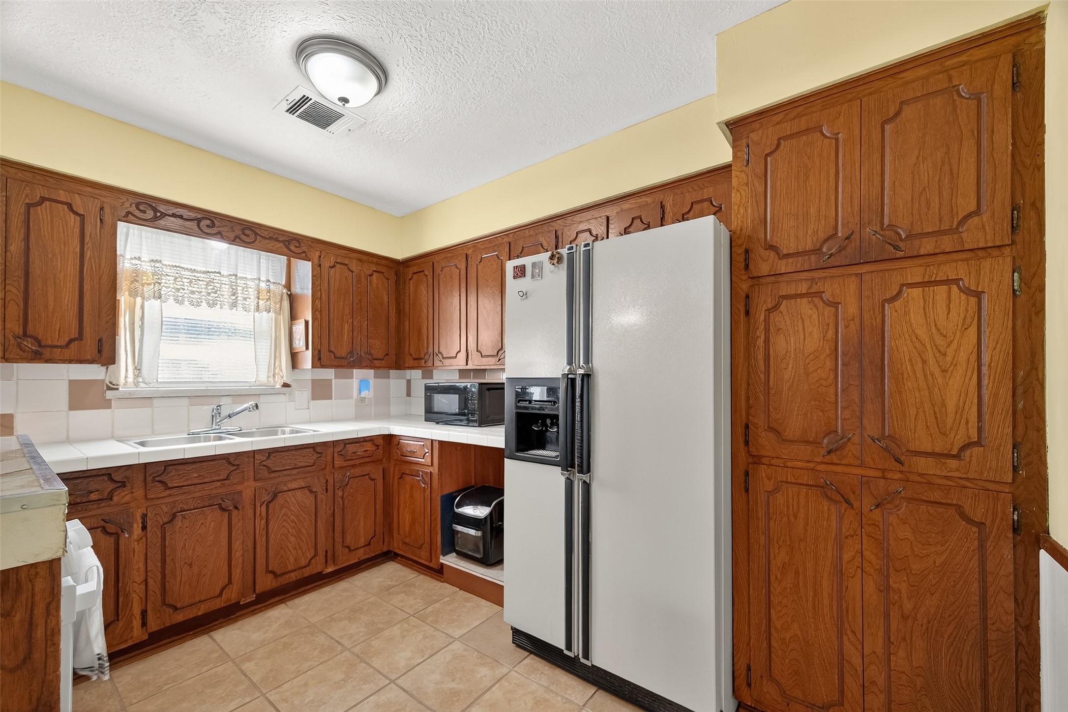 4802 Mistletoe Road Pasadena, TX 77505 - Photo 20 of 41 a white refrigerator freezer sitting inside of a kitchen