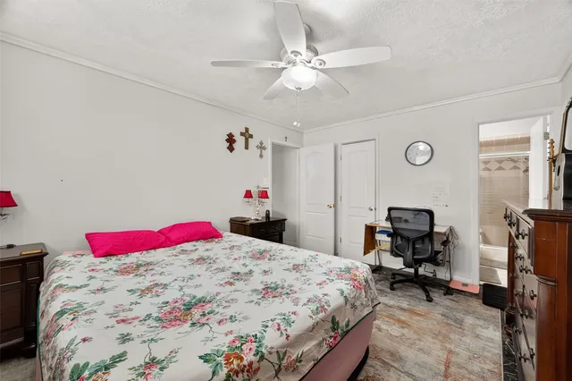 a bed room with a bed and a desk