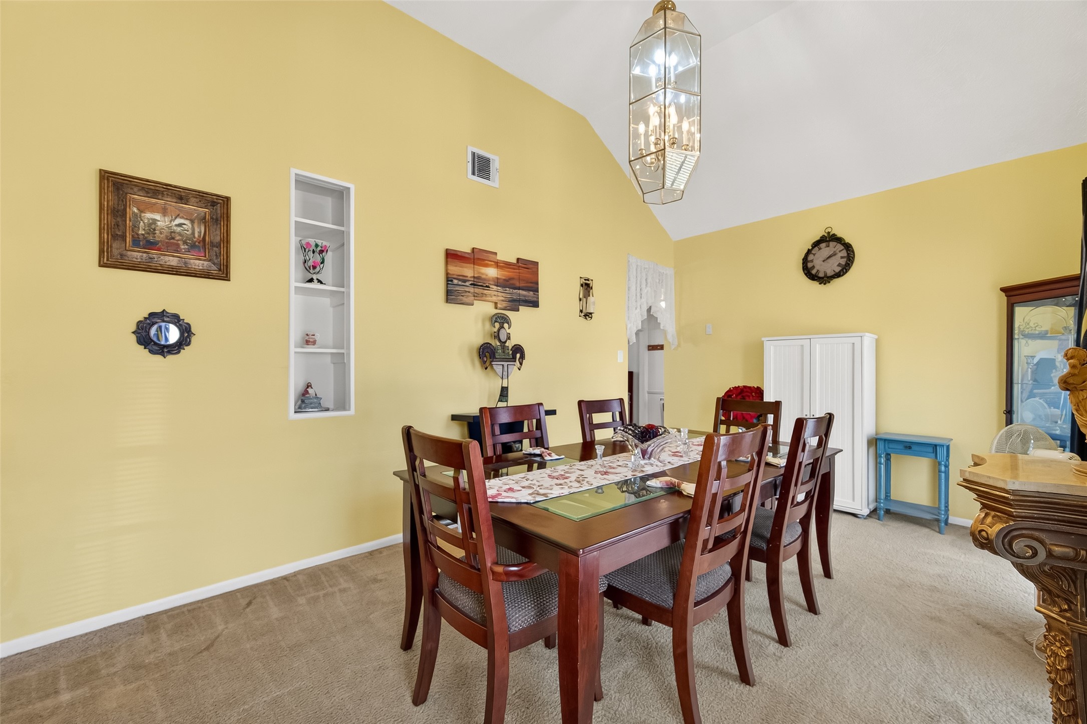 4802 Mistletoe Road Pasadena, TX 77505 - Photo 10 of 41 a view of a dining room with furniture and chandelier