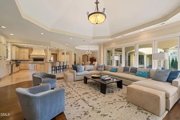 a large kitchen with stainless steel appliances kitchen island granite countertop a large counter top and a stove