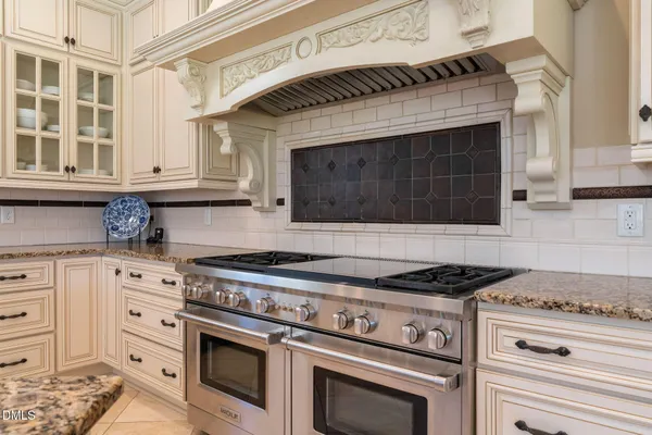 a view of a patio with table and chairs potted plants with wooden floor