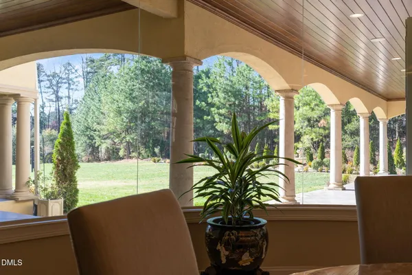 a spacious bathroom with a toilet a sink and mirror