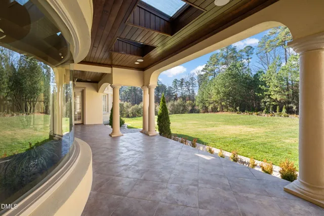 a bathroom with a granite countertop double vanity sink and a mirror