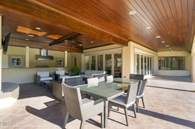 a bathroom with a granite countertop sink a mirror and a shower