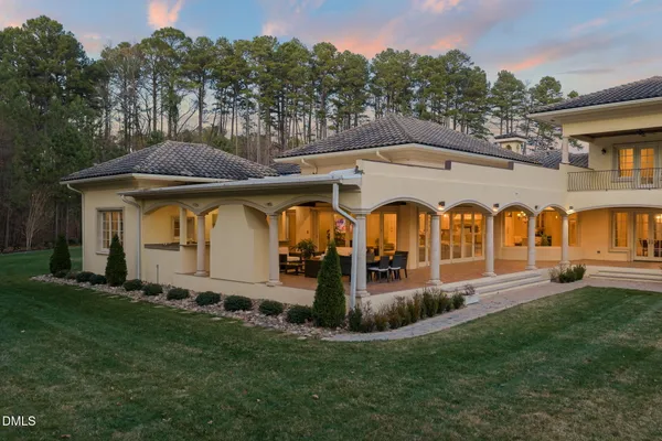 an aerial view of a house with garden space and a street view