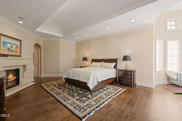 a bedroom with a large bed and a large window