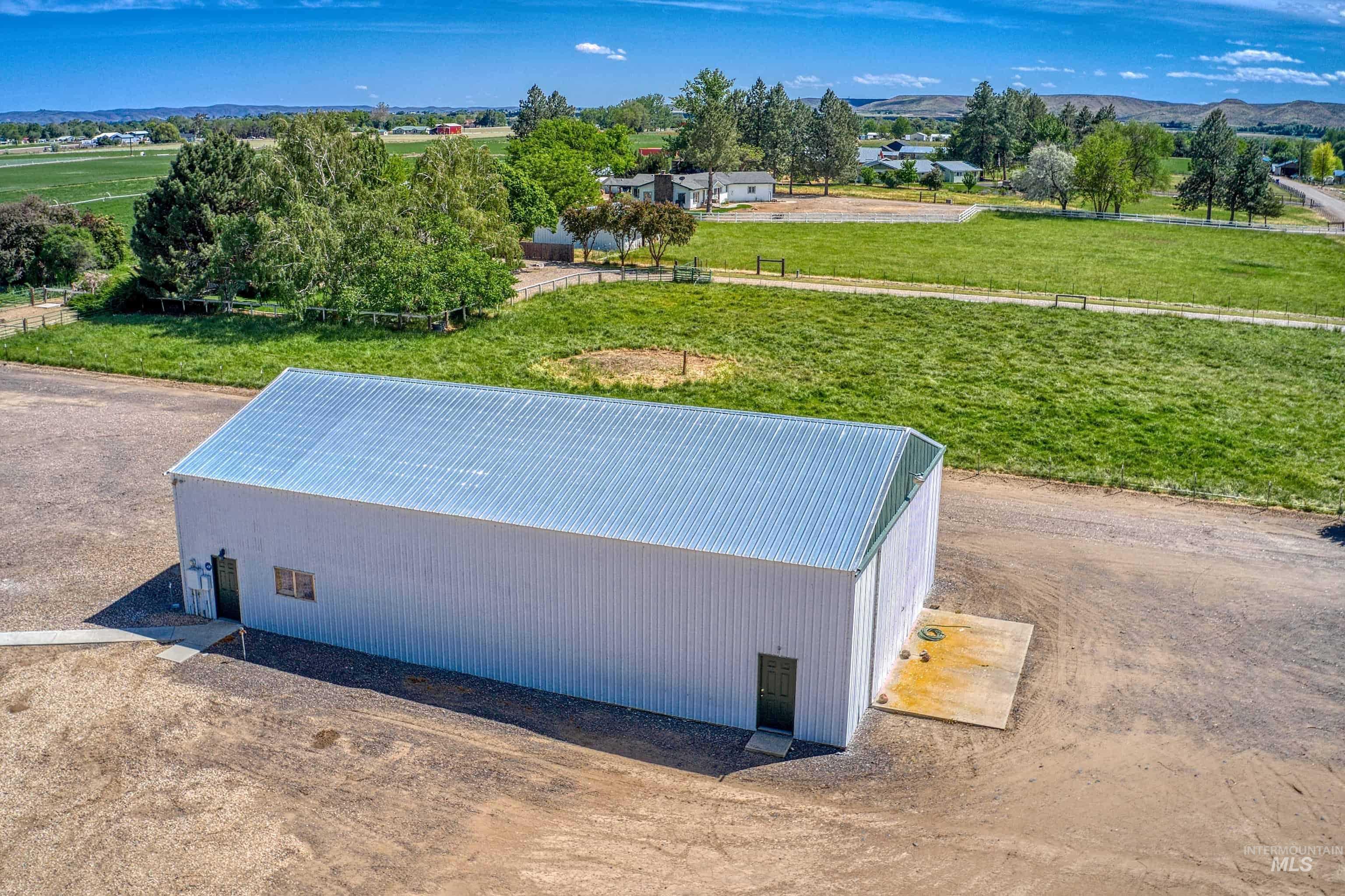 748 Pringle Road Weiser, ID 83672 - Photo 34 of 47 Large metal building featuring a corrugated metal roof and white siding