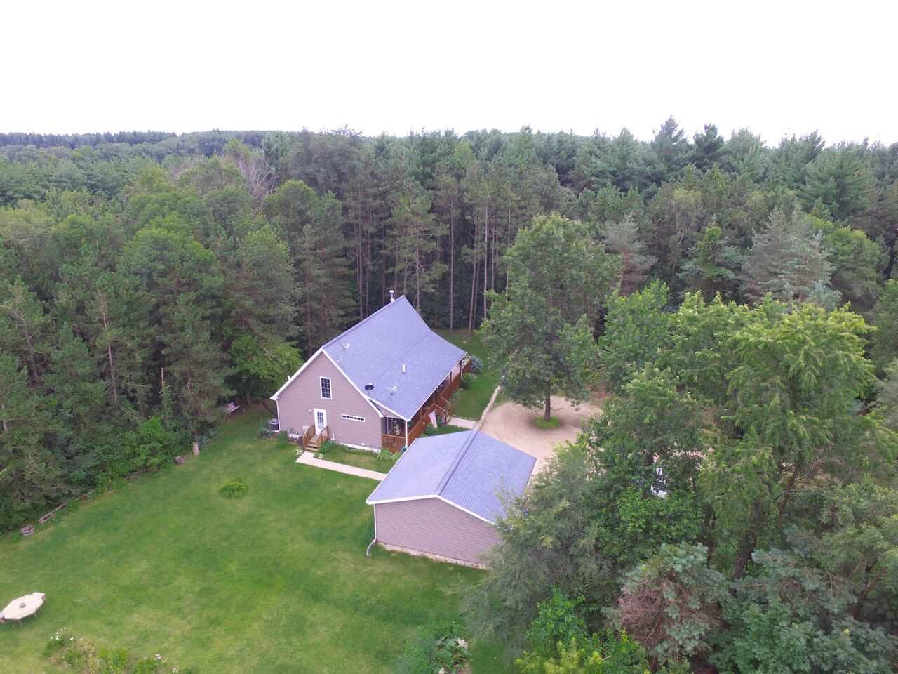 an aerial view of a house with a garden