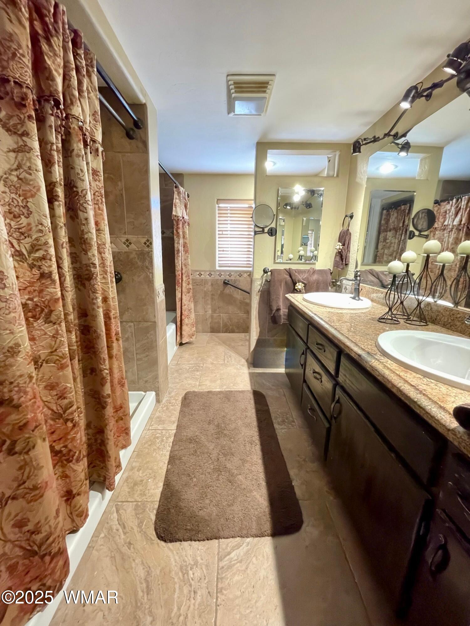 183 North Becker Lake Road Springerville, AZ 85938 - Photo 29 of 41 a large bathroom with a tub sink and mirror
