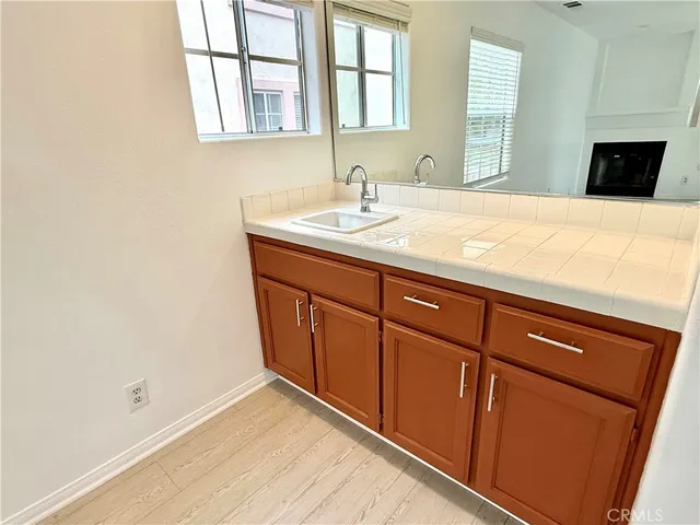 a view of kitchen and refrigerator
