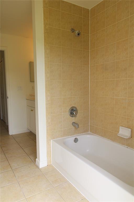 1489 Exchange Avenue North Port, FL 34288 - Photo 18 of 25 a bathroom with a bathtub and shower