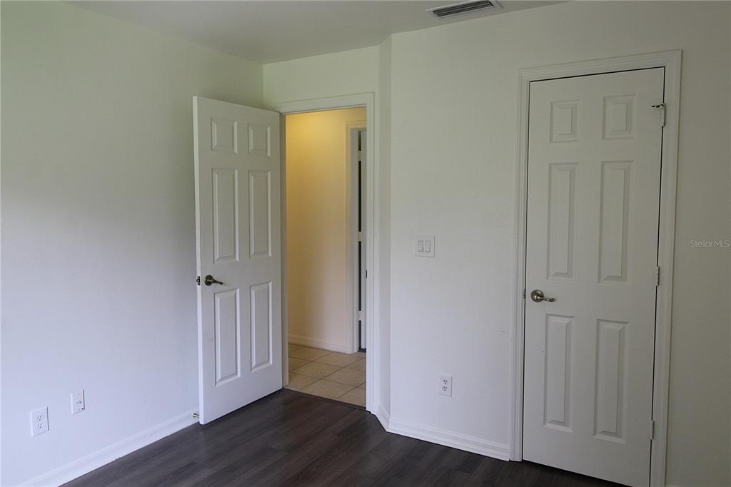 1489 Exchange Avenue North Port, FL 34288 - Photo 20 of 25 a view of a hallway with wooden floor