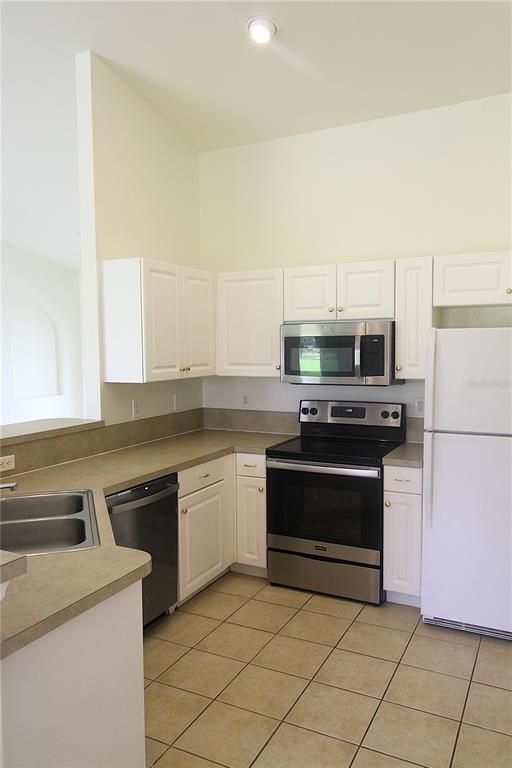 1489 Exchange Avenue North Port, FL 34288 - Photo 2 of 25 a kitchen with granite countertop a stove and a sink