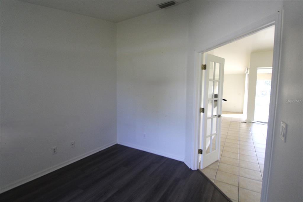 1489 Exchange Avenue North Port, FL 34288 - Photo 10 of 25 a view of a room with wooden floor