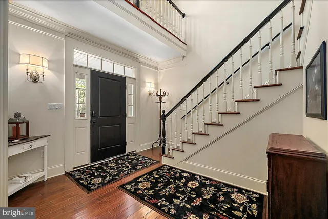 a view of a chairs and table on the wooden deck