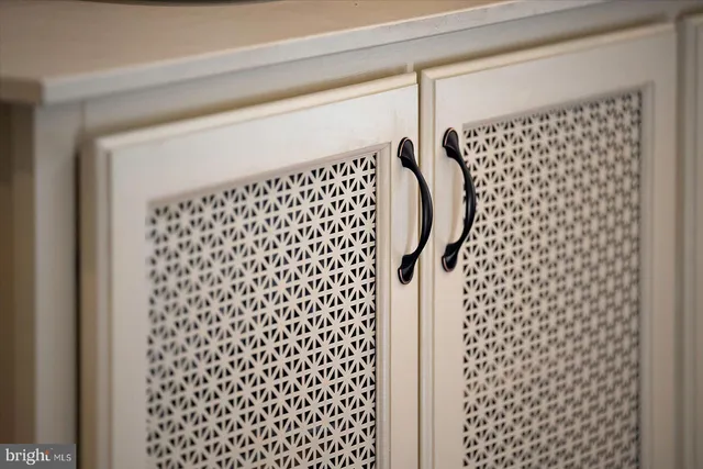a living room with furniture fireplace and a large window