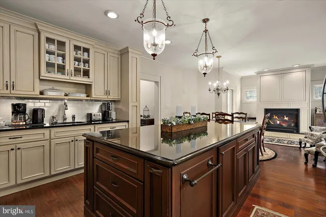 a view of a building with a yard and sitting area