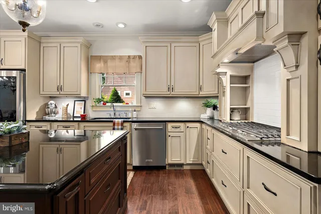 an aerial view of a house with a garden and trees