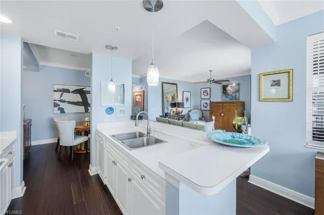 a spacious bathroom with a granite countertop sink and a large mirror