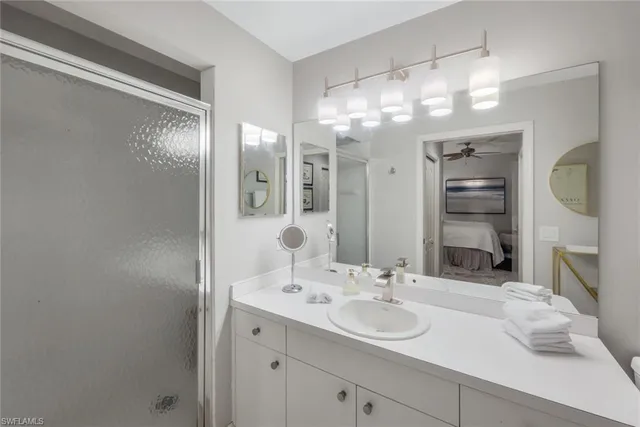 a bathroom with a sink double vanity and a mirror