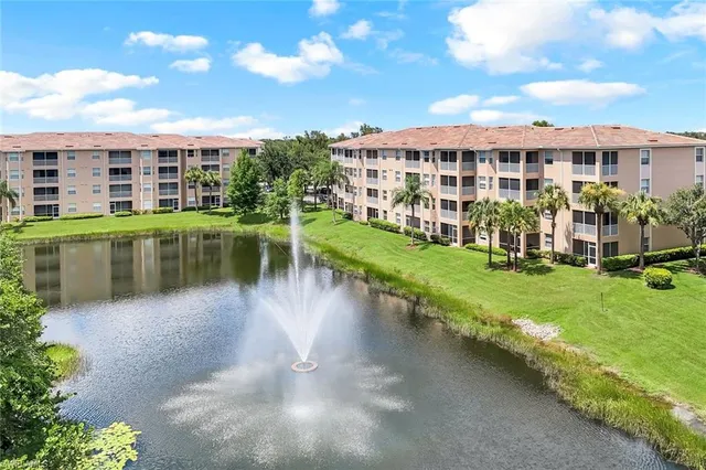 a view of a lake with a building in the background