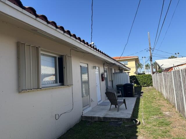 1911 Northeast 27th Court, Unit 13 Lighthouse Point, FL 33064 - Photo 18 of 61 a house view with a outdoor space