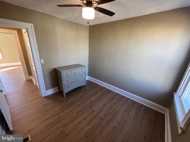 a room with furniture and wooden floor