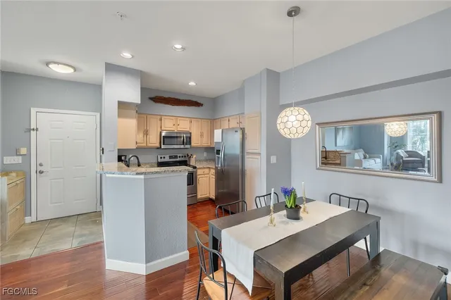 a view of kitchen with cabinets and wooden floor