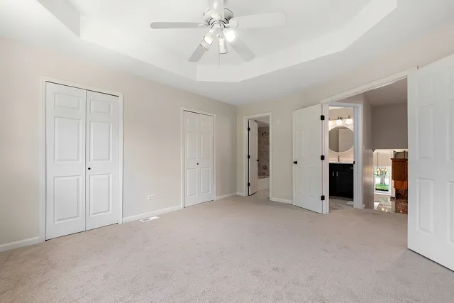 a view of empty room with a ceiling fan