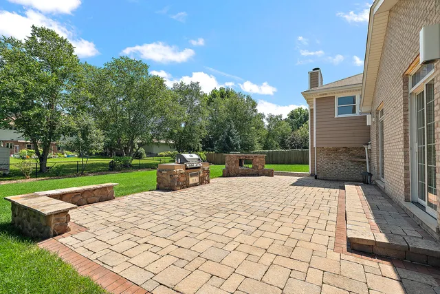 a view of a backyard with sitting area